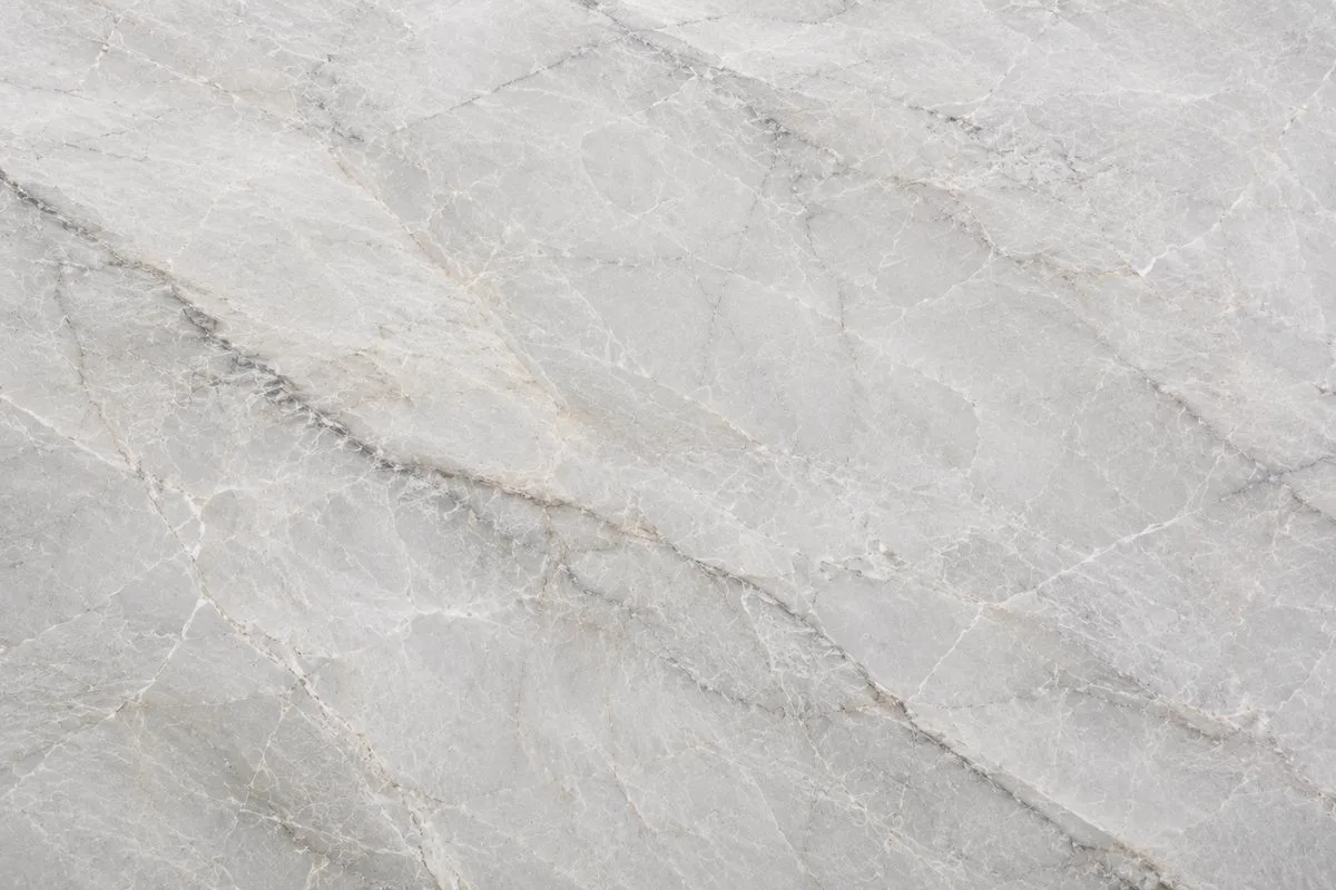 Close up of a white grey quartzite countertop slab with fine grey veining in Austin